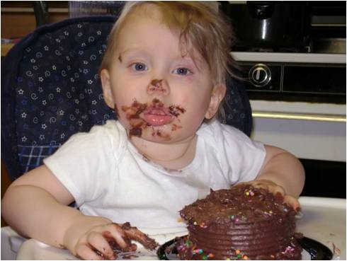 picture of fat kid eating cake. Down for oy eating even a